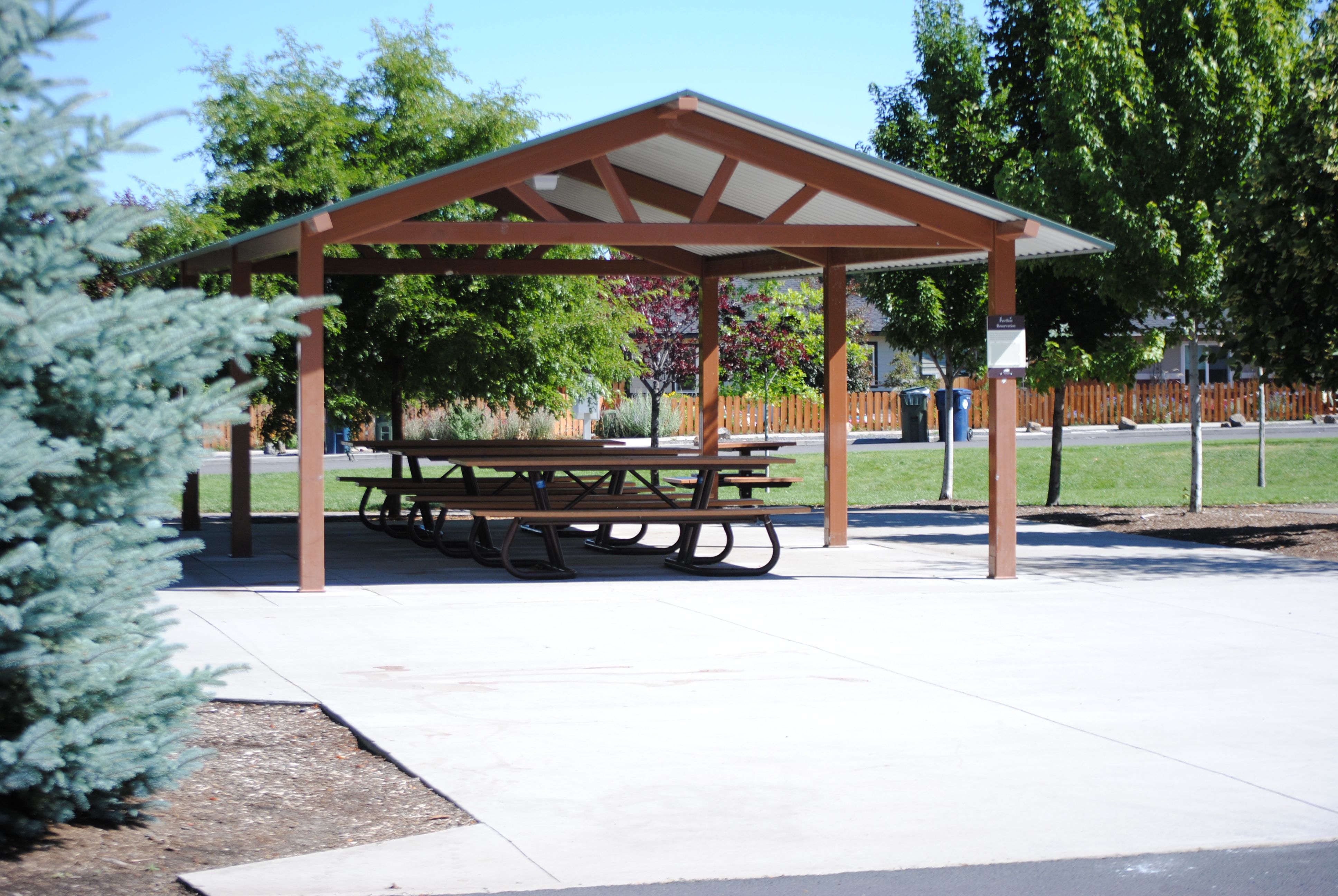 the large shelter and picnic tables at al moody park
