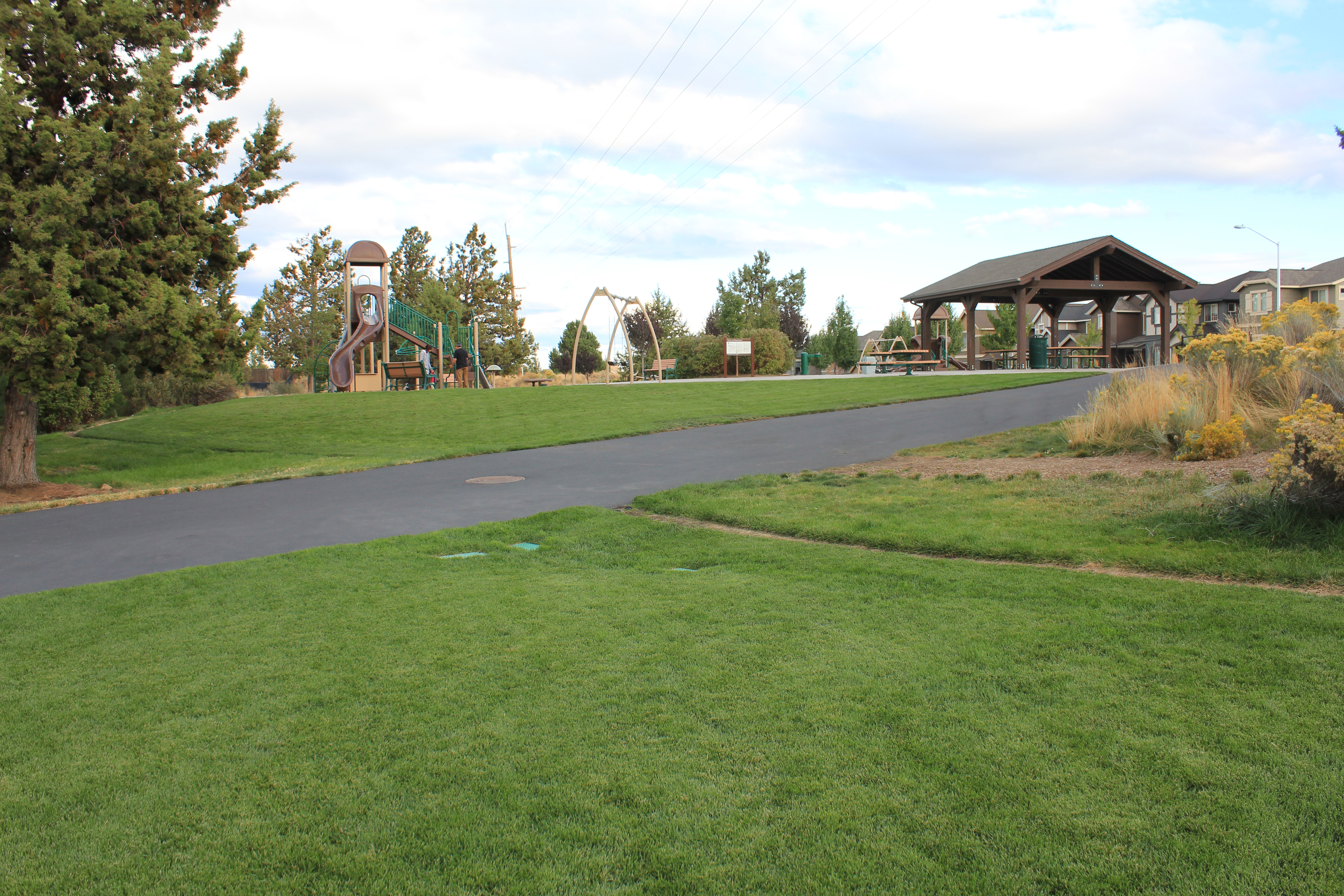 a view of the playground from the lawn