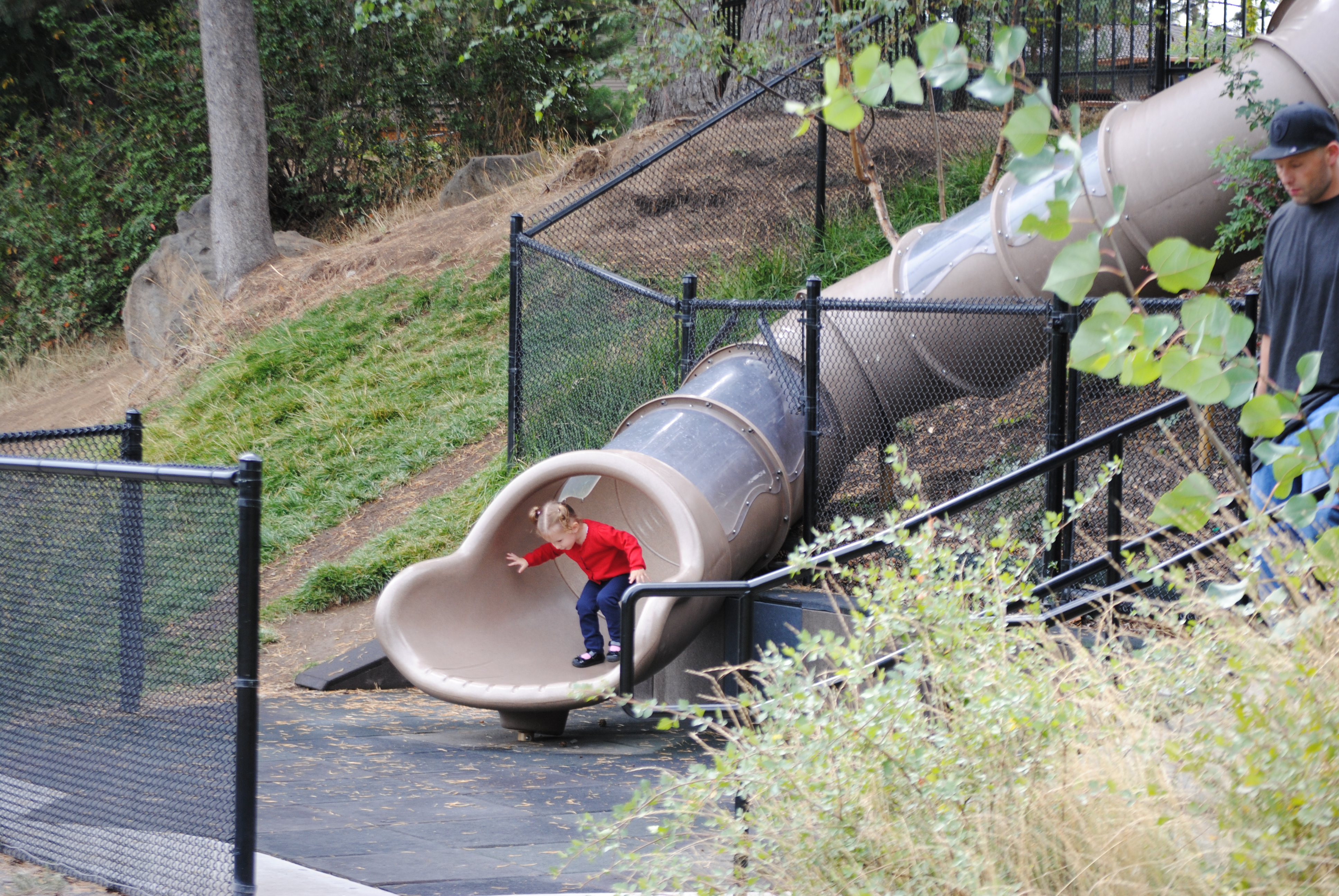 A child coming out of a tube slide at Columbia Park.