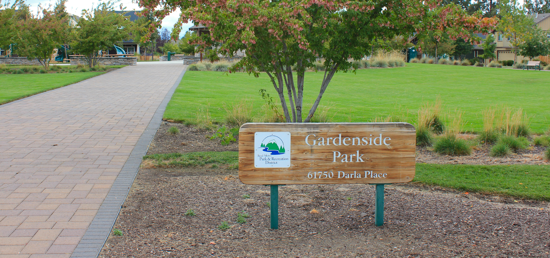 Gardenside park's sign and greenspace.