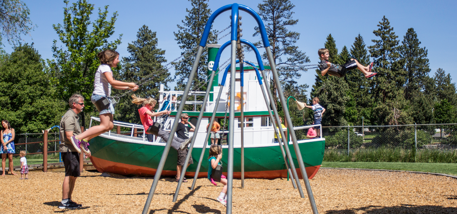 Kids swinging at Harmon Park.