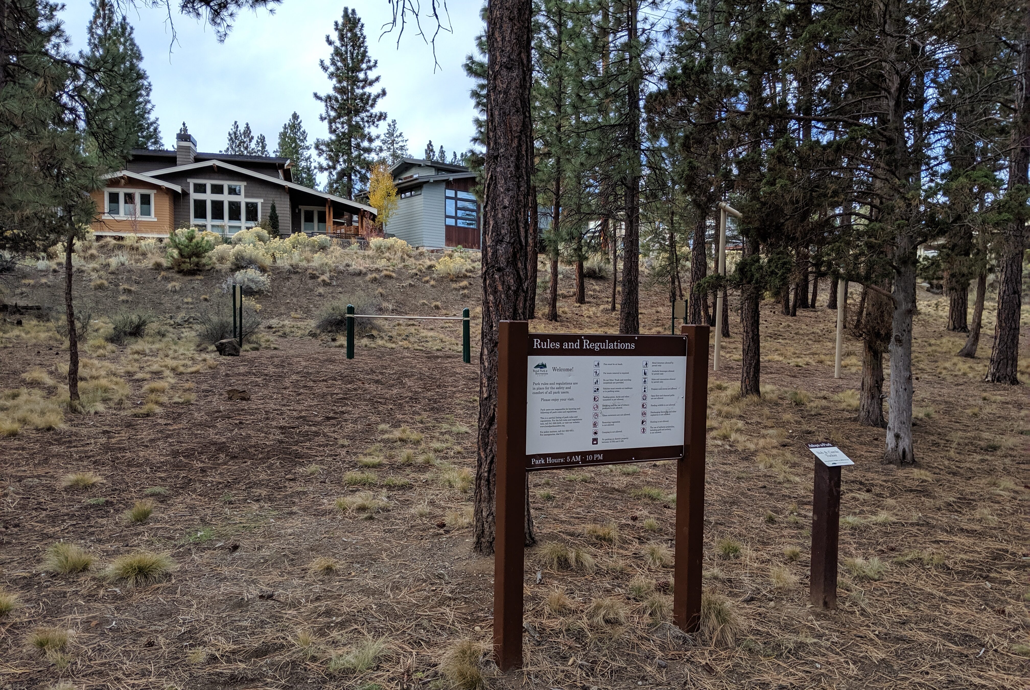 Park sign and exercise equipment and sunset view park