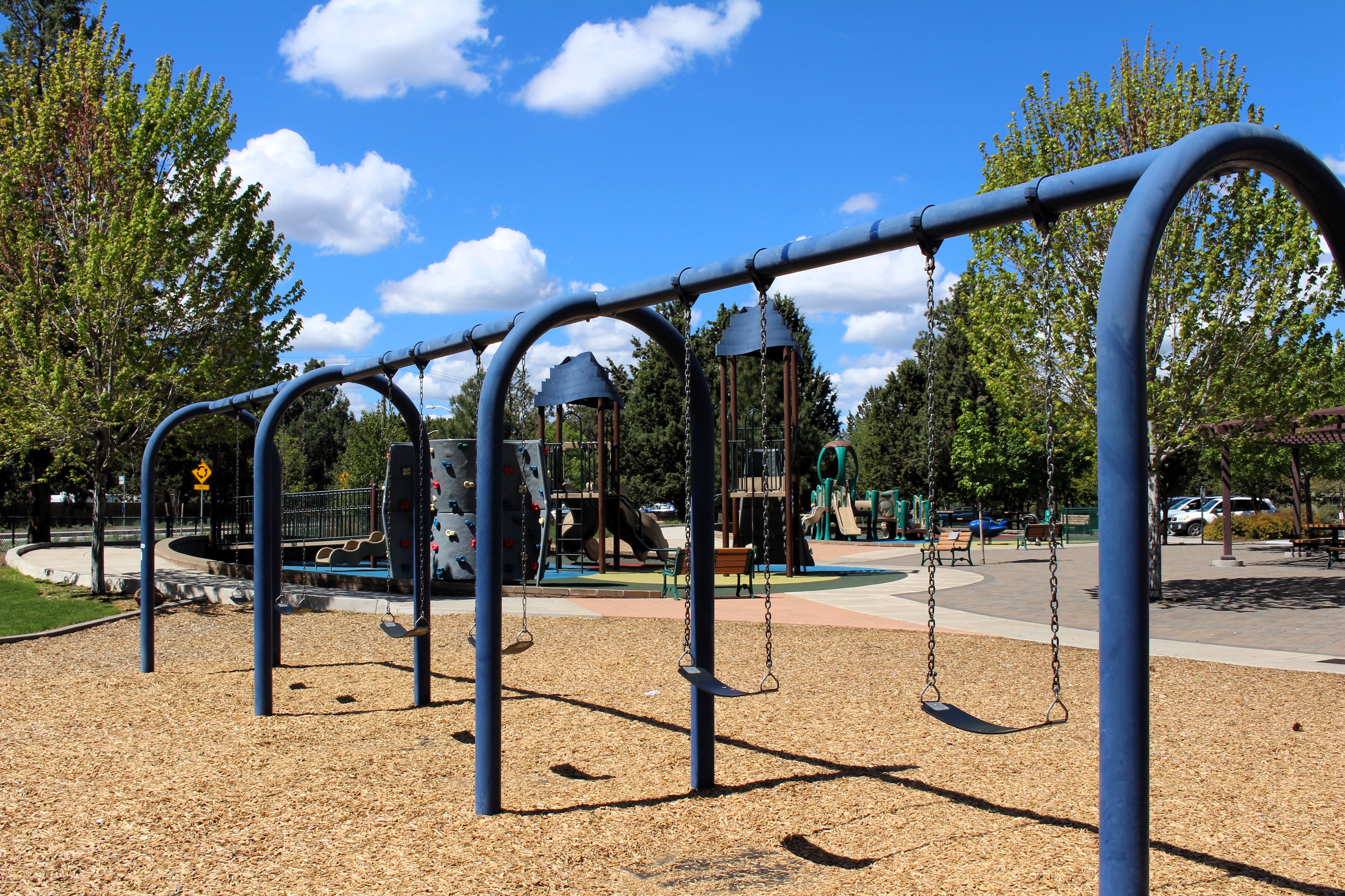 the swings at the playground at larkspur park
