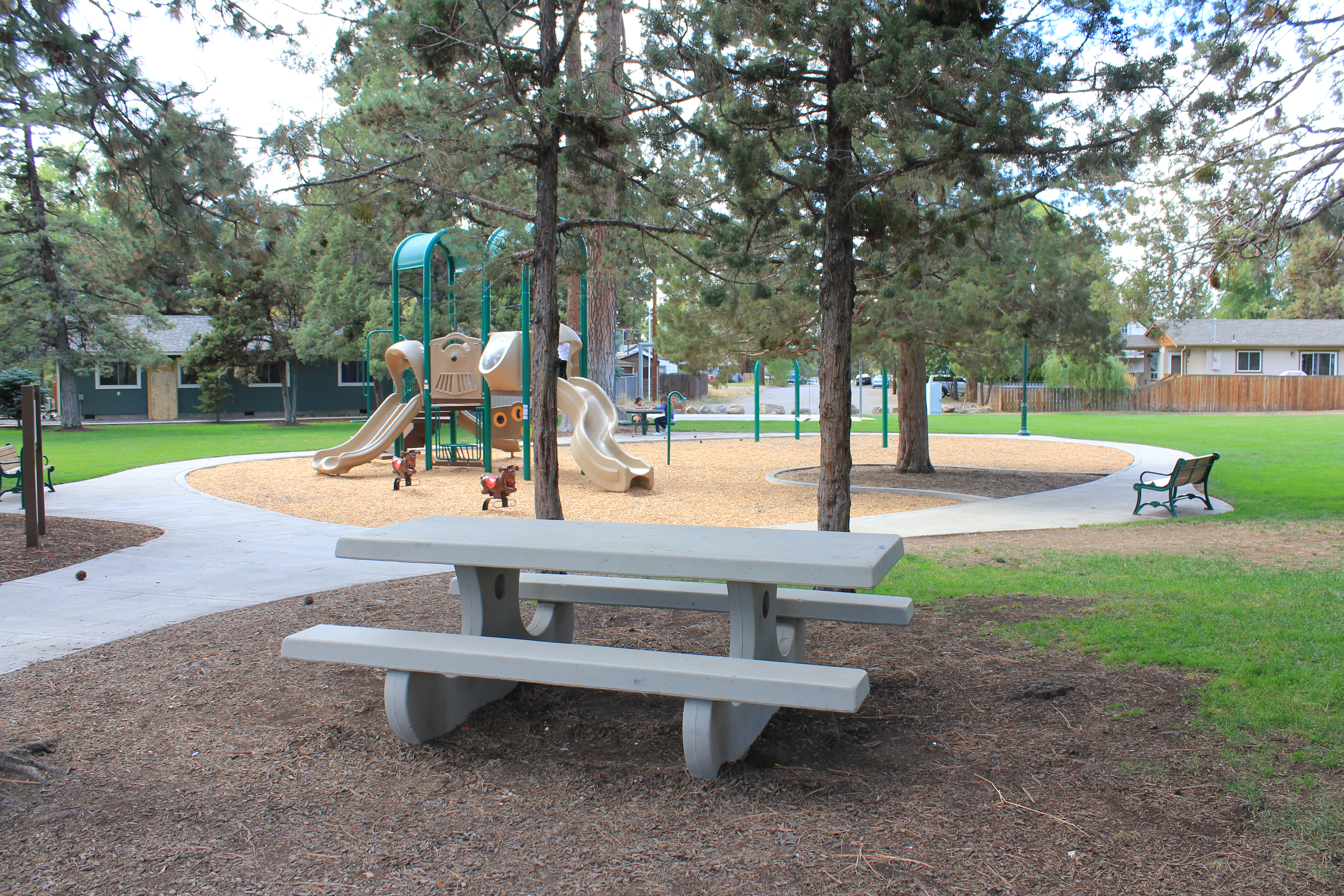 A picnic bench under the trees at Jaycee Park