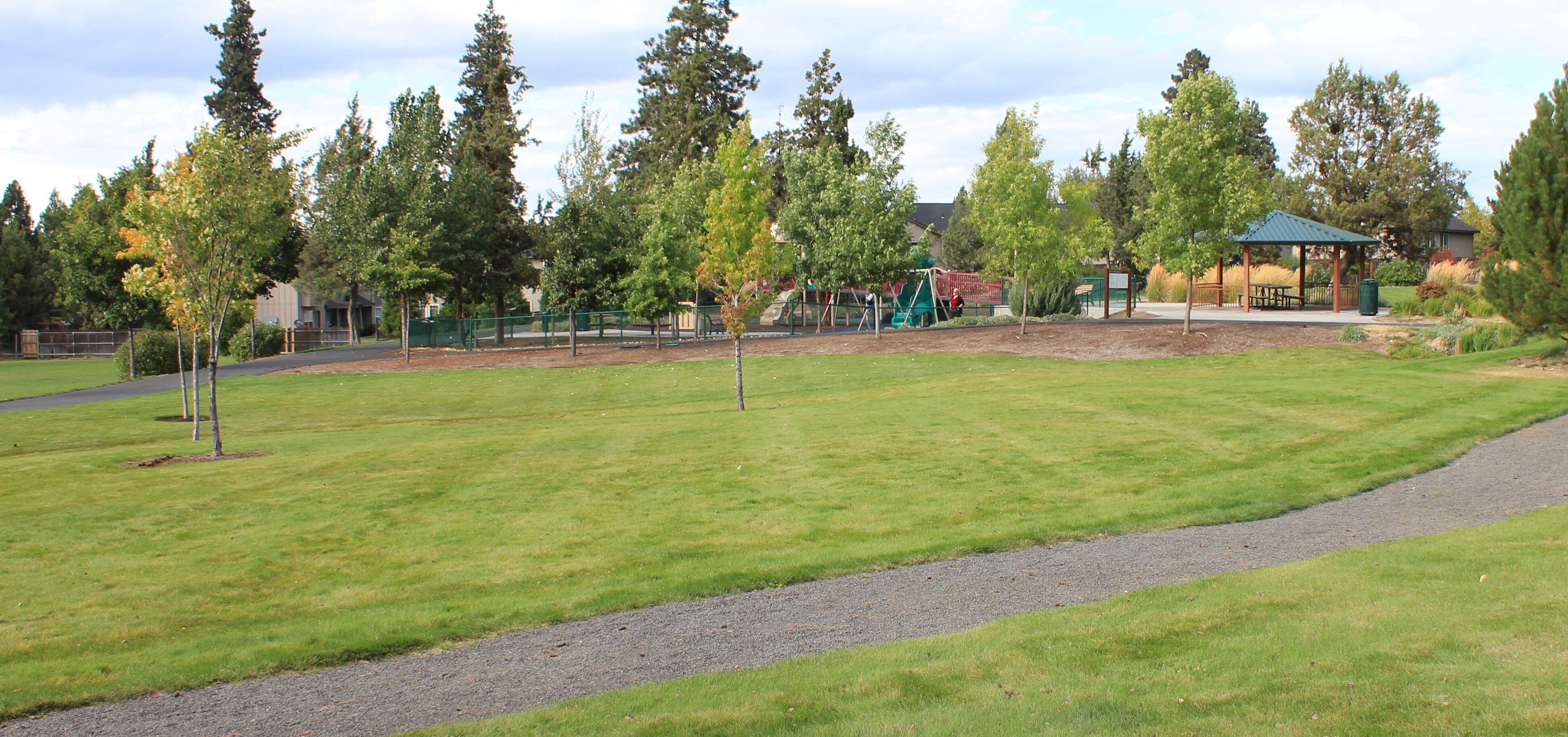 a trail and open space at Orchard Park
