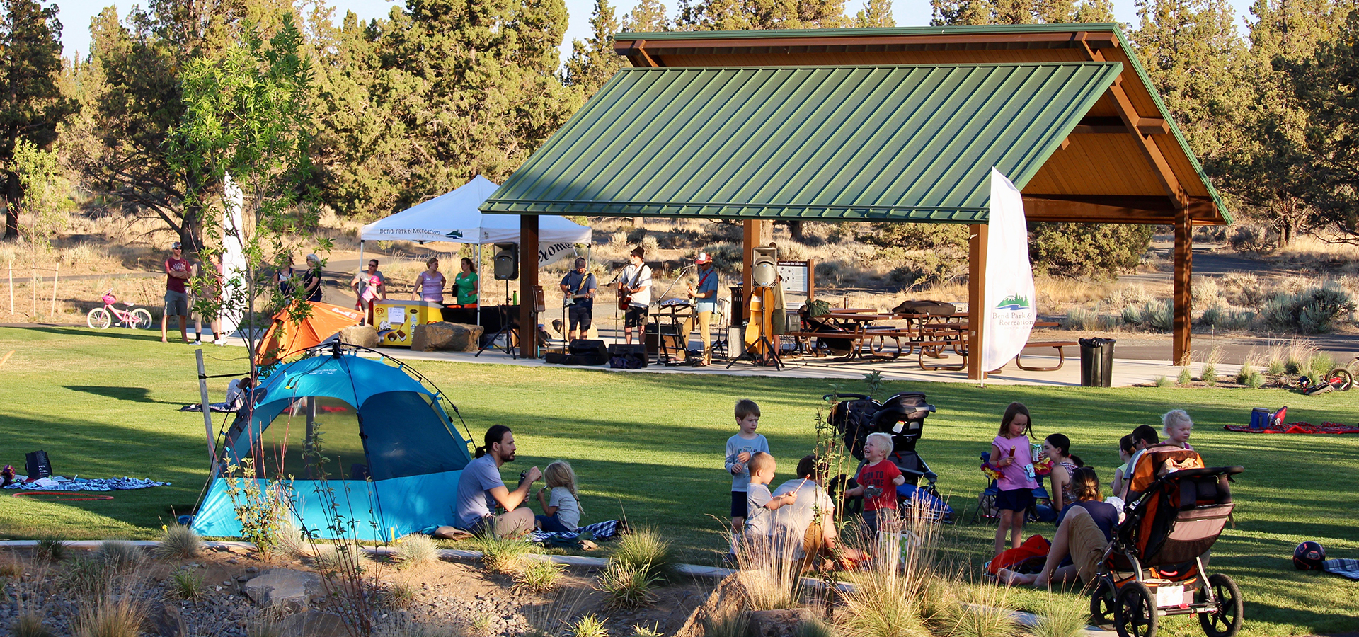 families enjoying live music outside at Rockridge Park