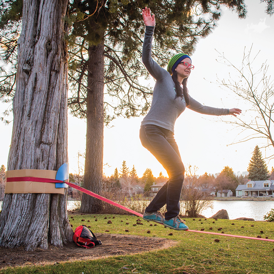 a woman slacklining in drake park