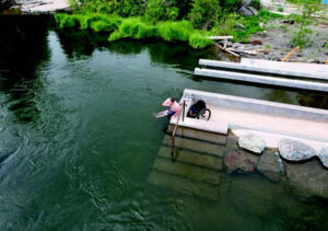 Image of wheelchair patron transfering to the dry ramp wall at Miller's Landing.