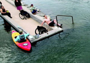Image of wheelchair patron getting out of the water.
