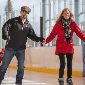 A couple ice skating together