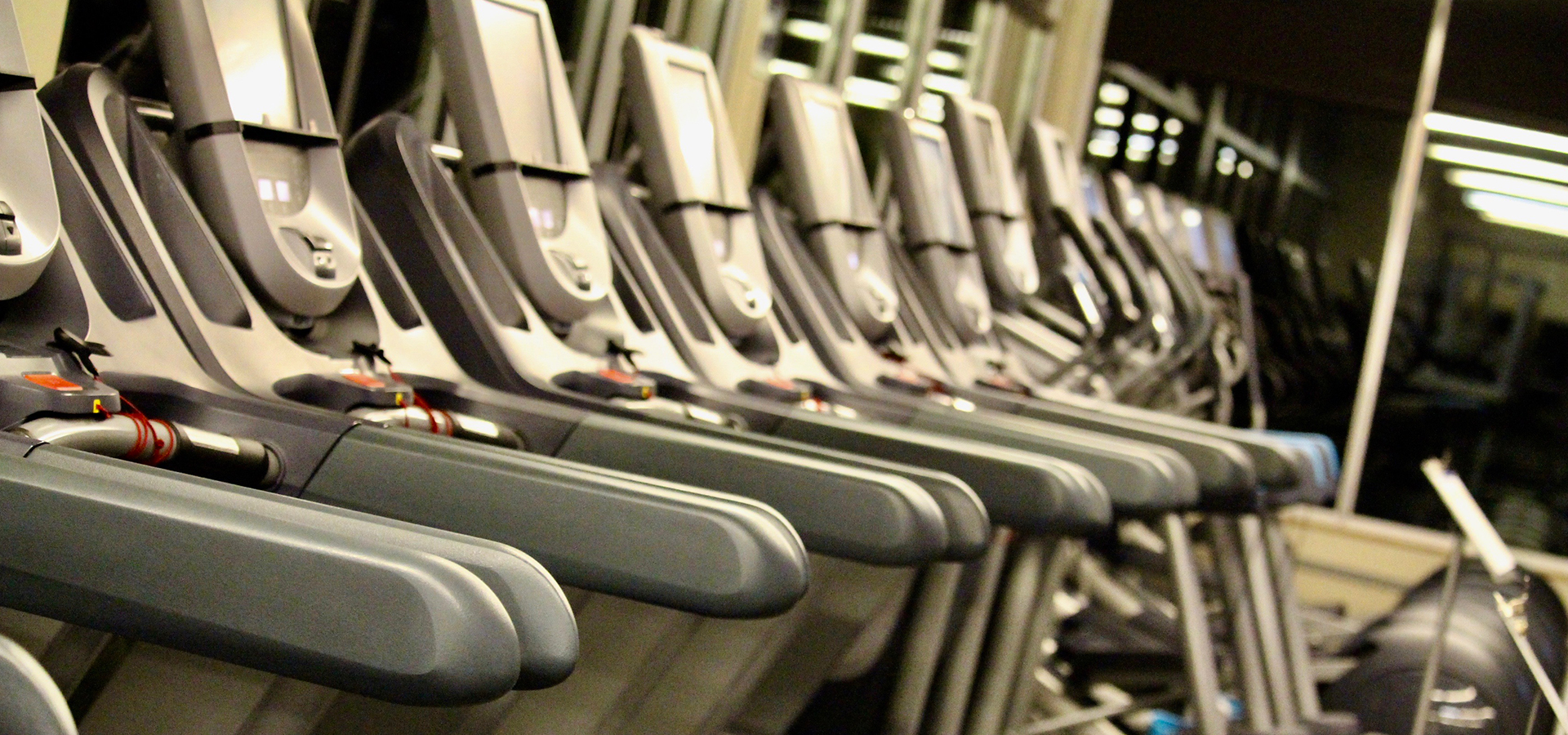 A row of treadmills with no one on them at Juniper.