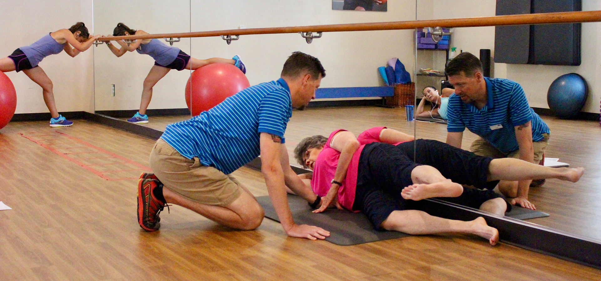 A personal trainer working with a patron at Juniper.