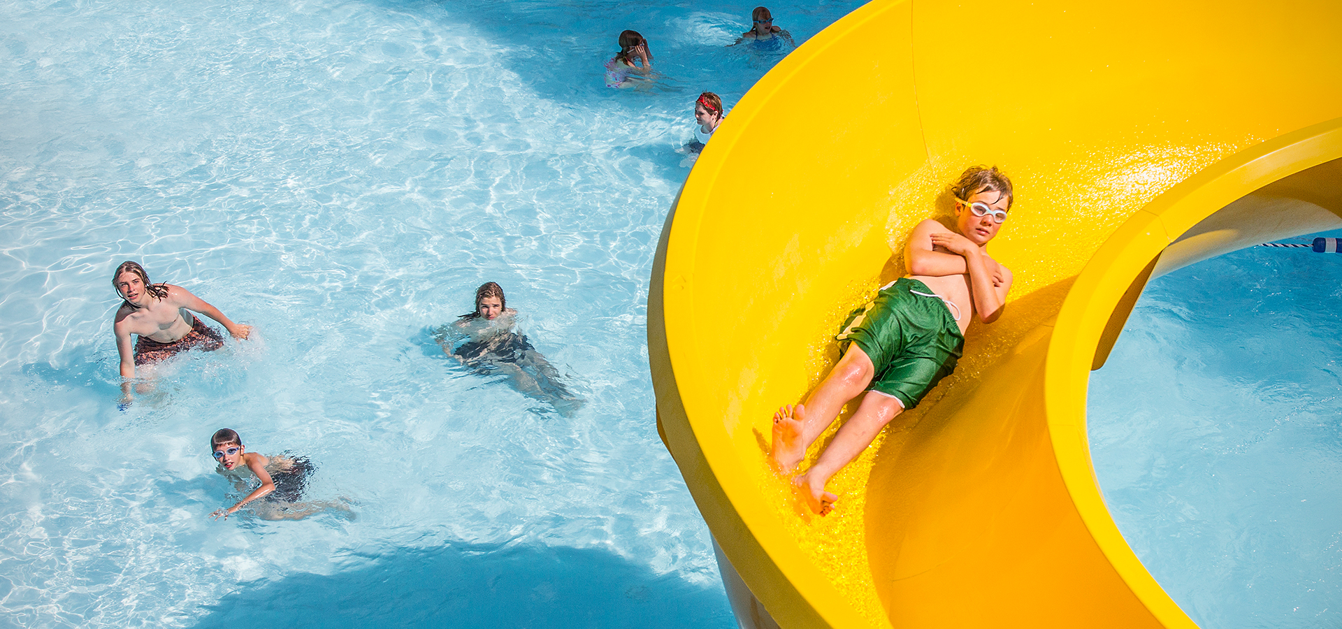 A boy on a water slide.