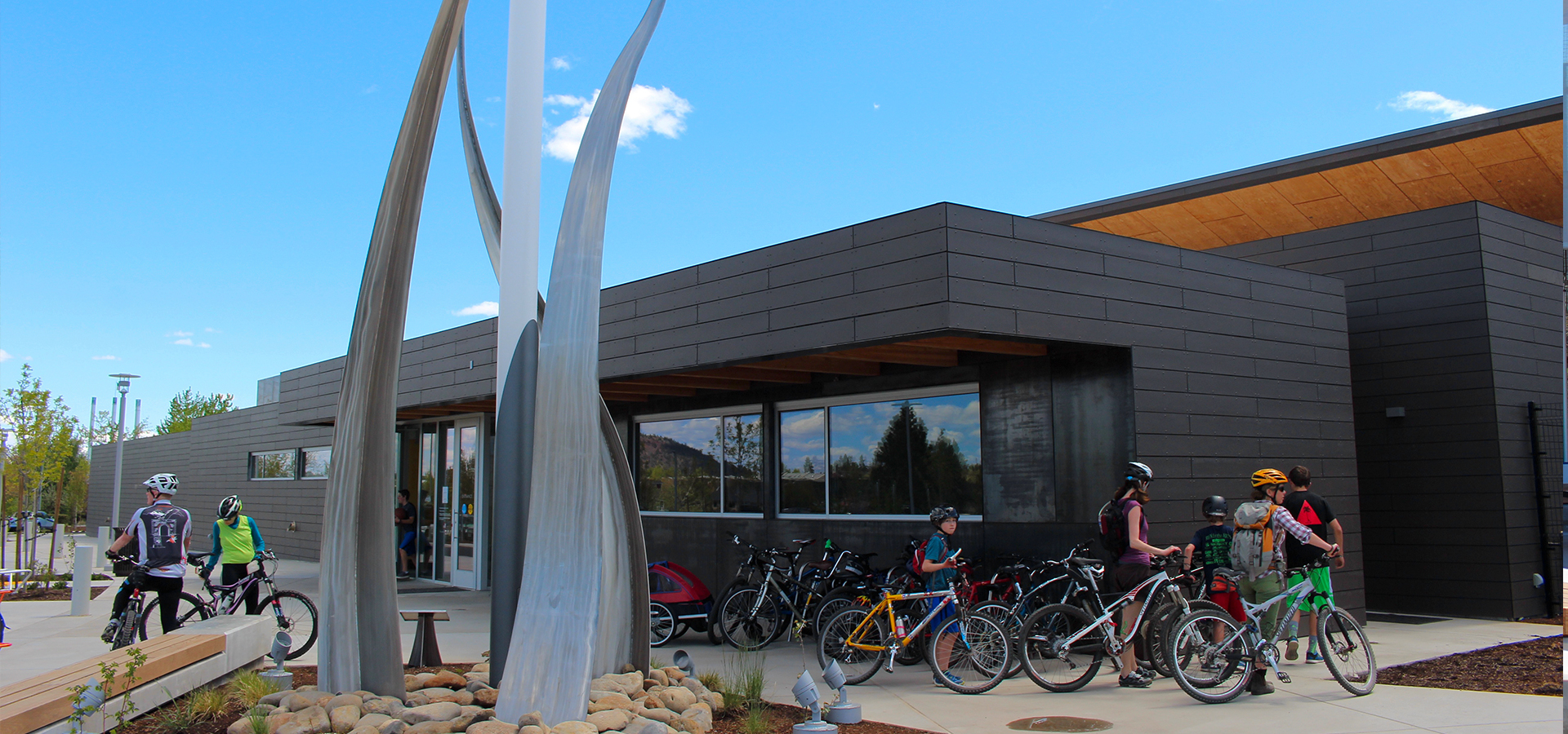 A group of people parking their bikes outside The Pavilion.