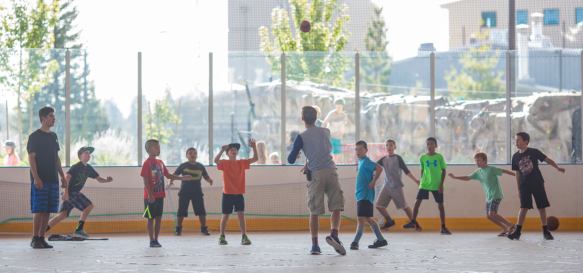 A youth rec leader playing with kids at The Pavilion in the summer.