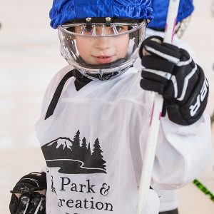 A young kid at hockey practice.