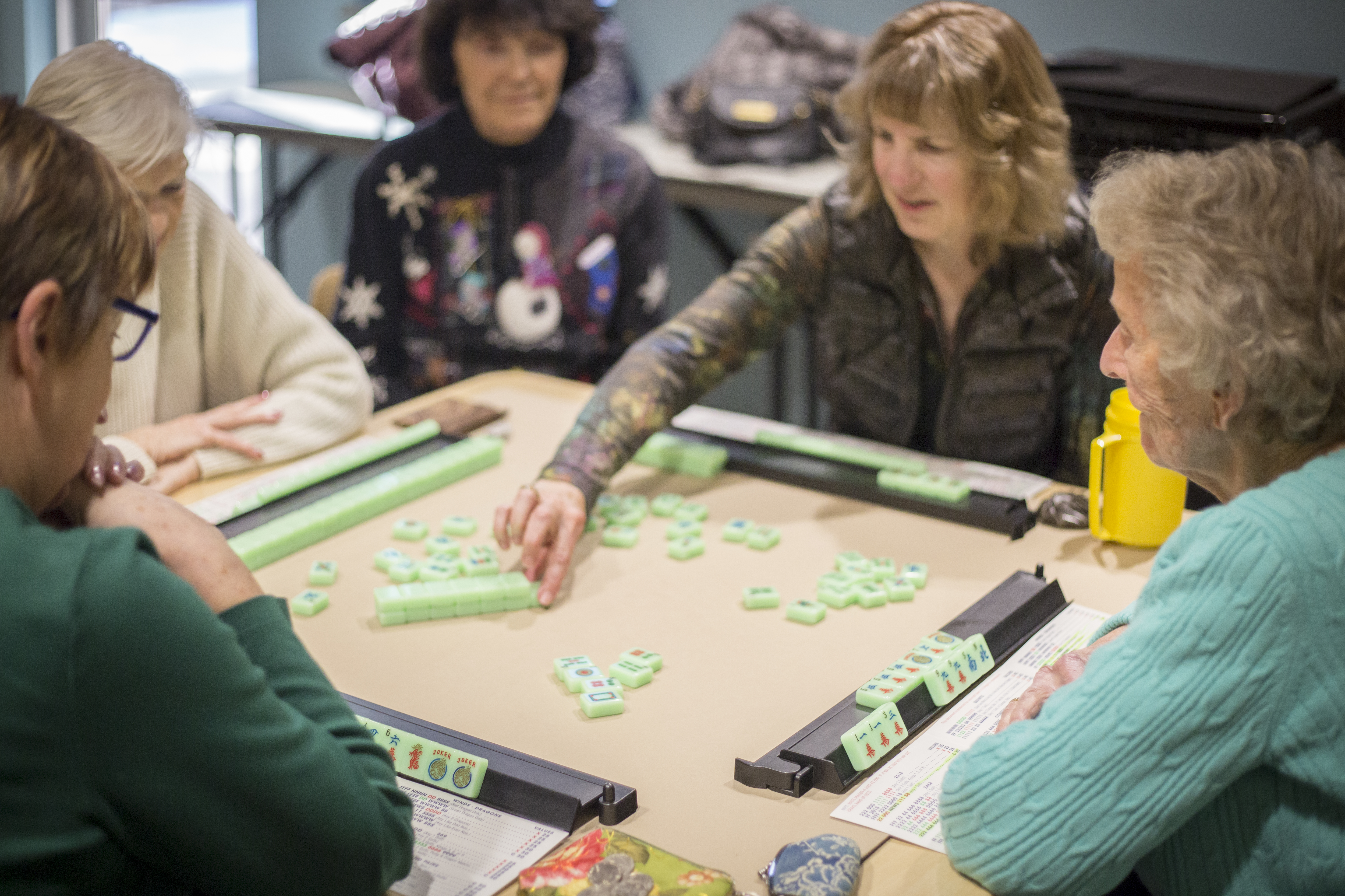 A group of older adults play games at Social activity at Bend Senior Center.