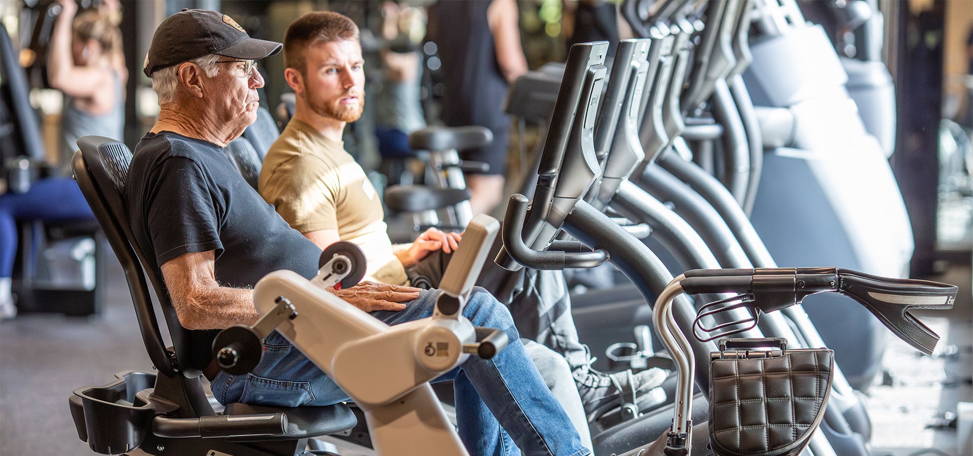 Patrons use cycling machines at Juniper Swim & Fitness Center