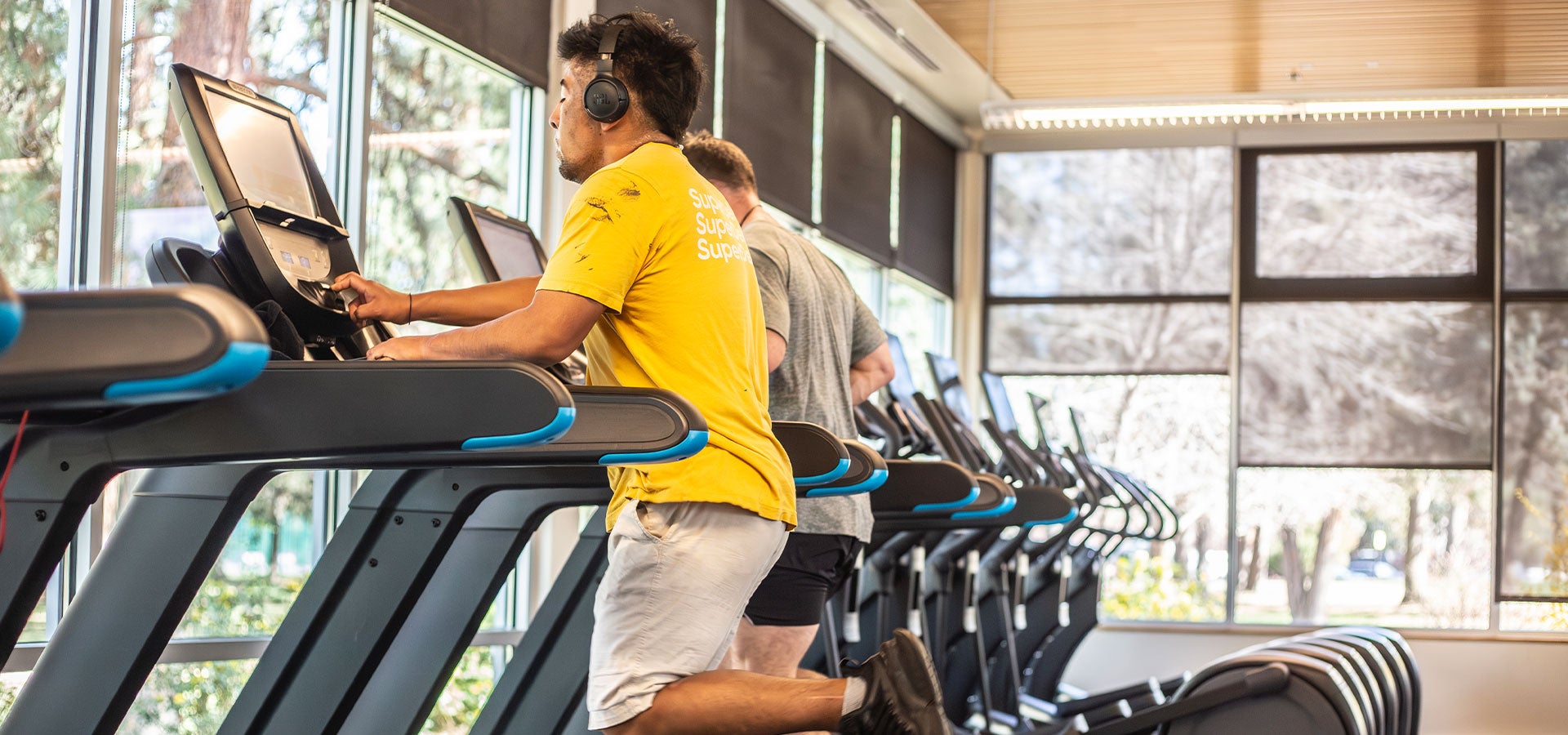 Patrons using treadmills at Juniper Swim & Fitness Center