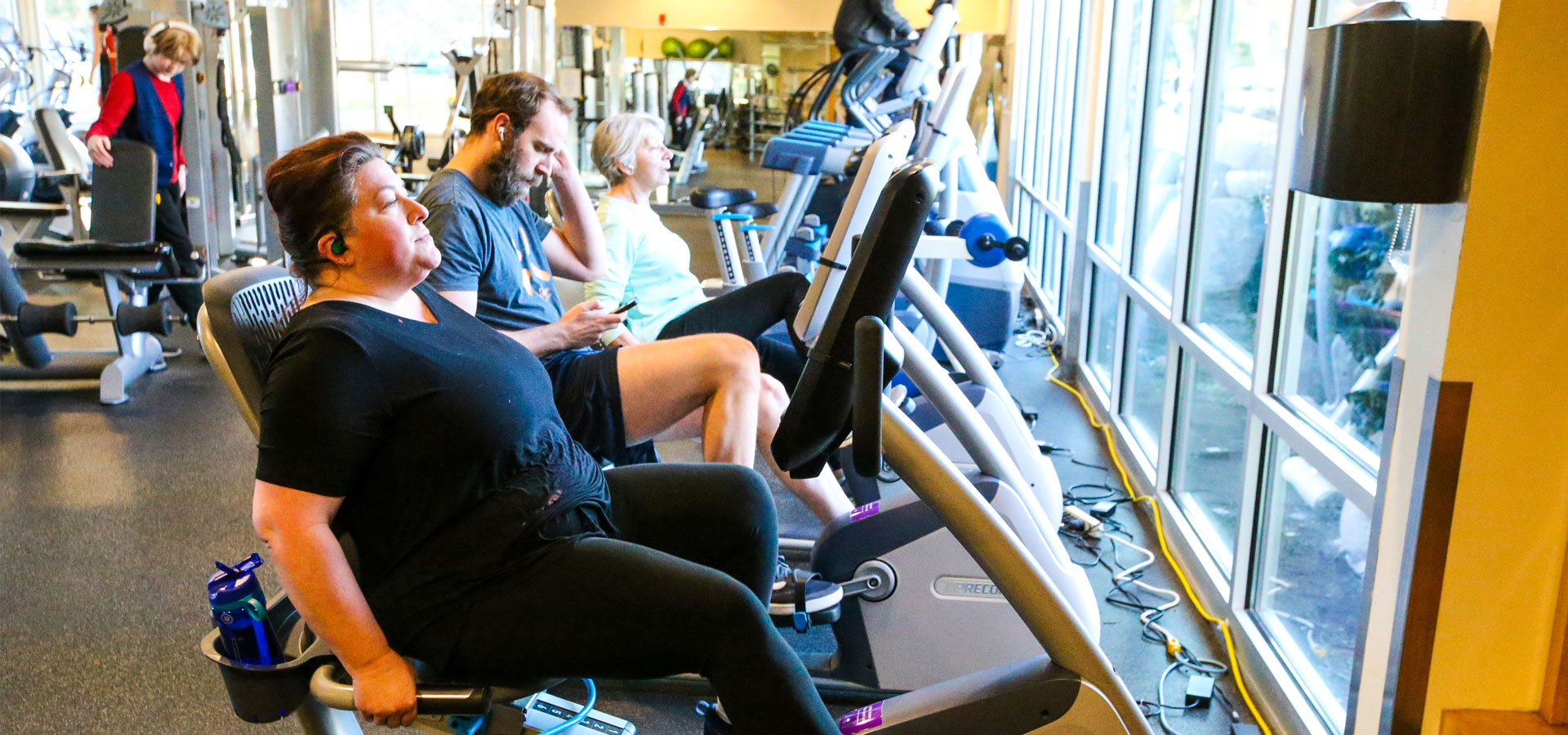 A group of Juniper patrons using the excercise bikes at the fitness center
