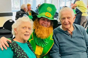 Photograph of patrons and participants in costme at the St. Patricks Day dance.