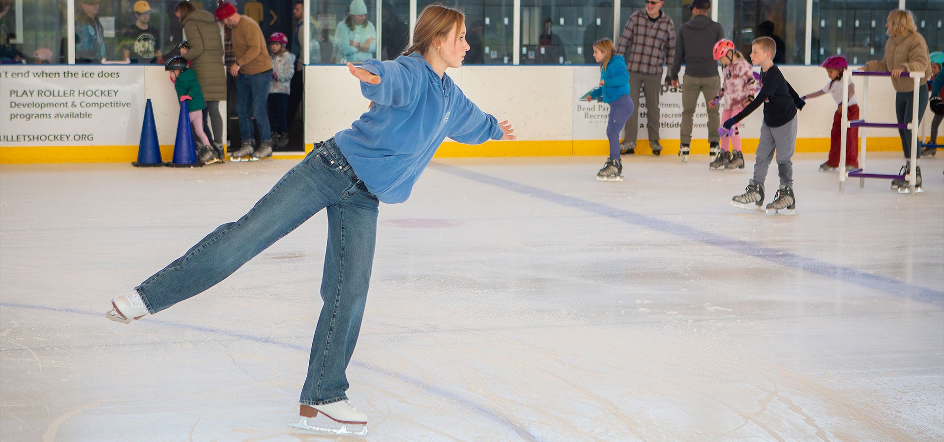 Photo of a young ice skater balancing at the Pavilion