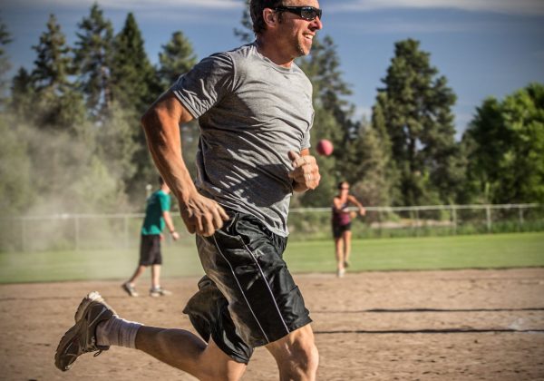 An adult kickball game at Harmon Park.