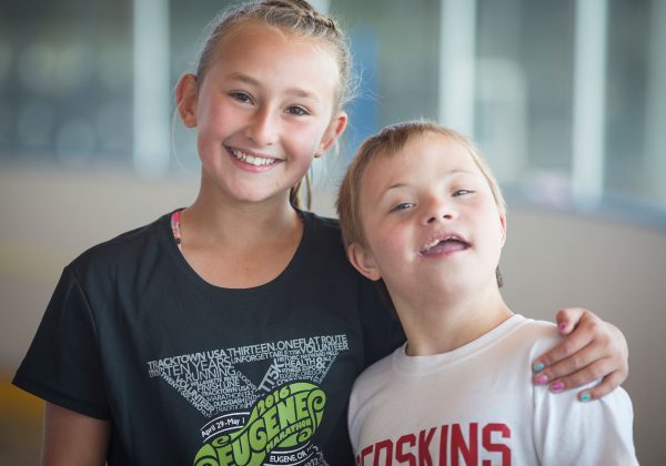 Two kids posing for a photo.