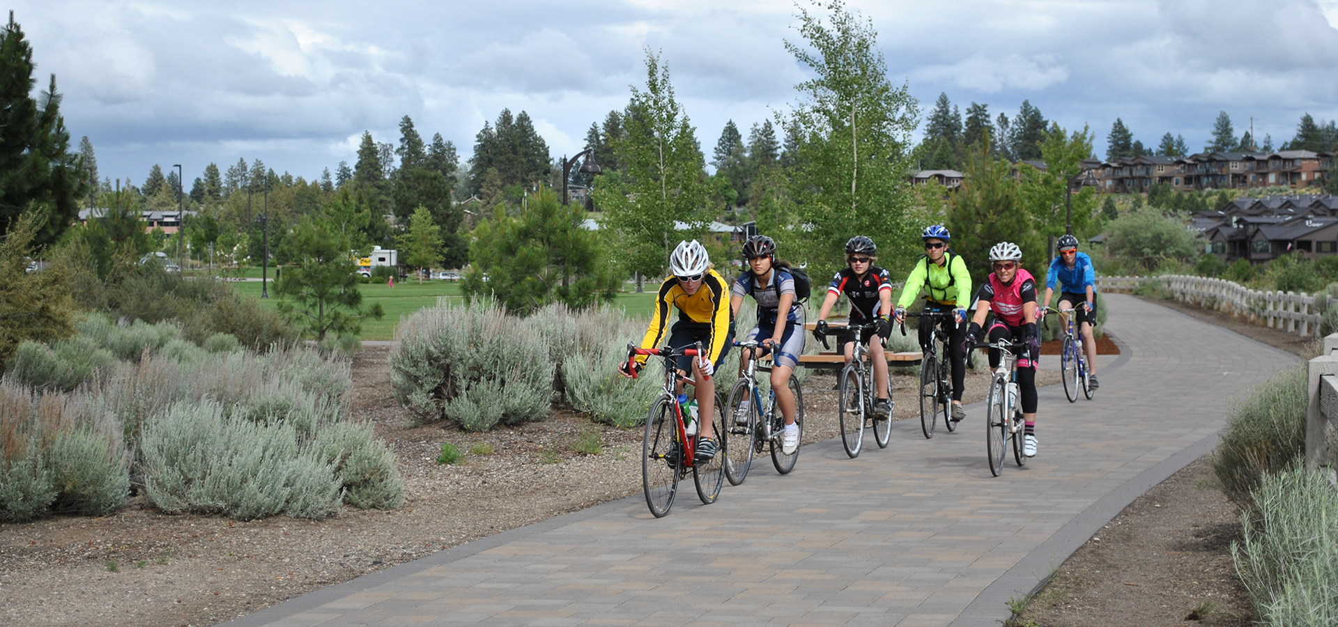 A group of cyclists on the Deschutes River Trail in Riverbend Park.
