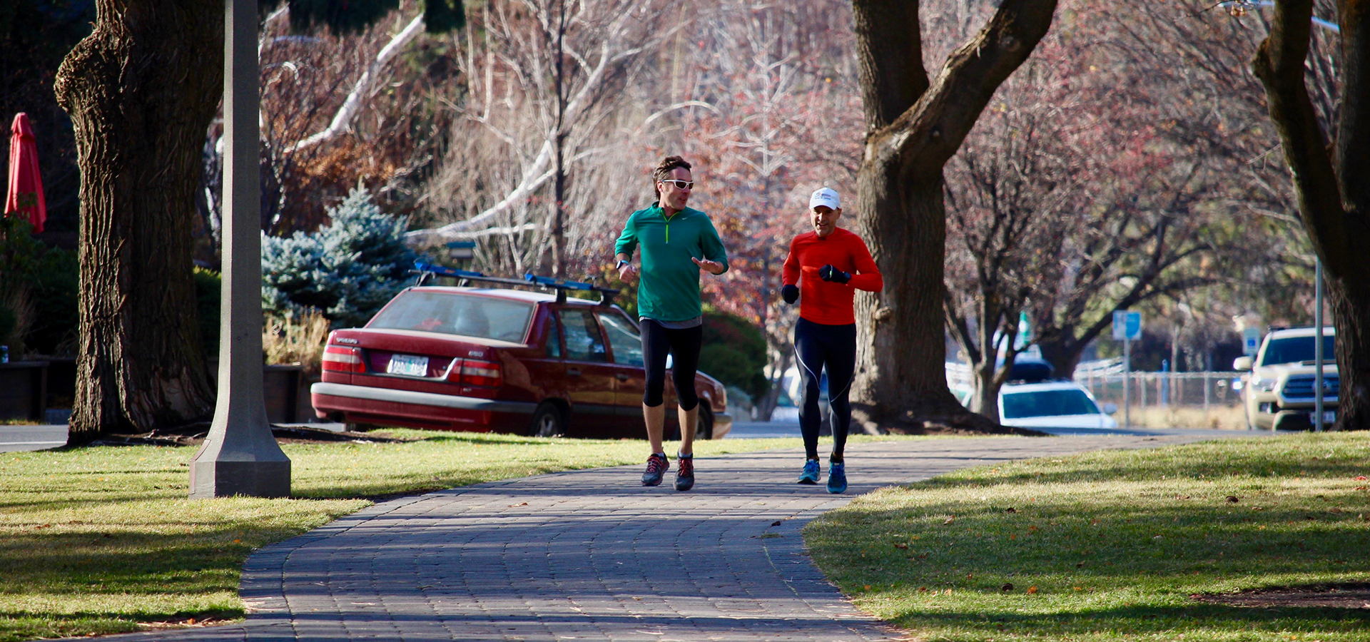 Two joggers in Drake Park.