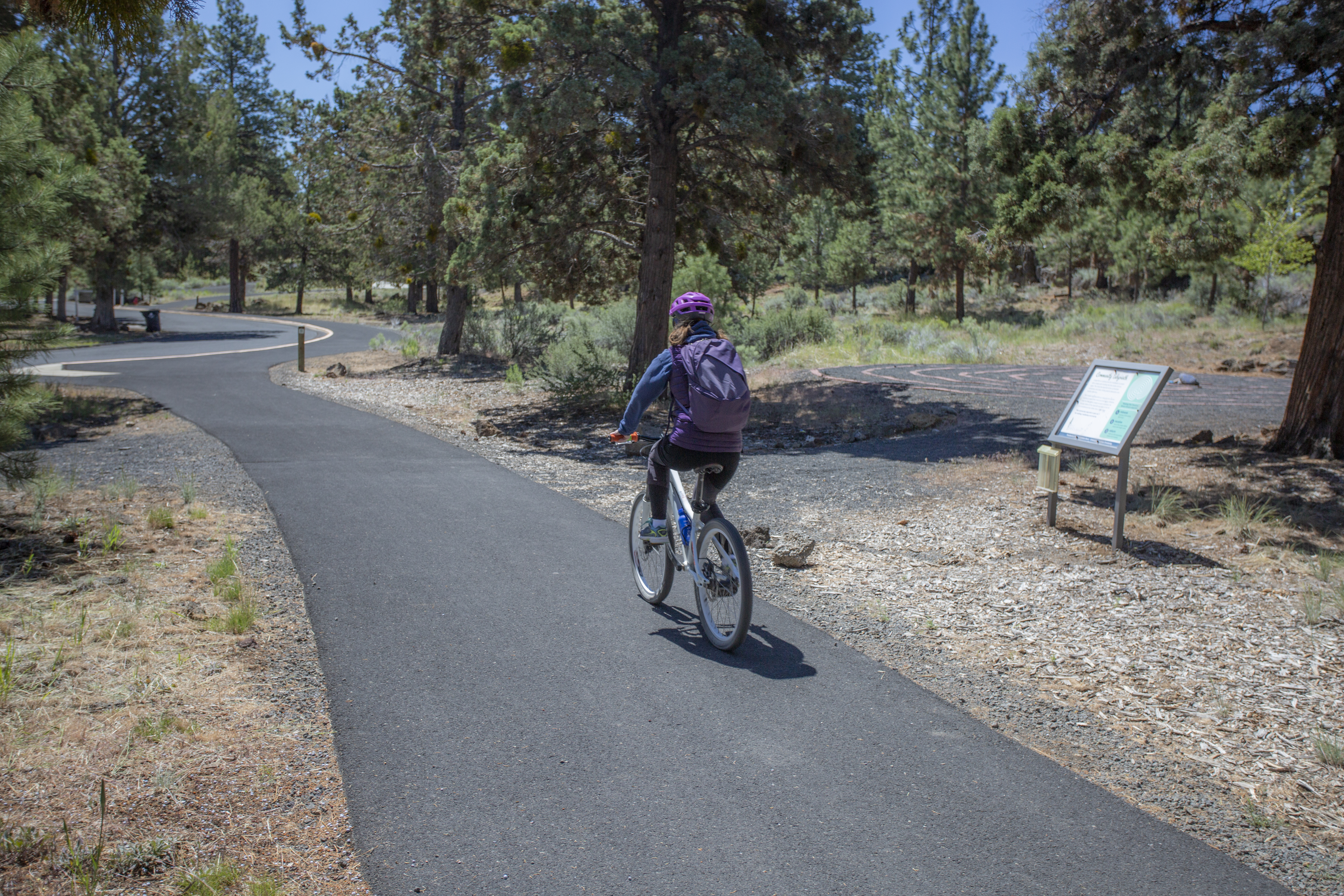 A trail user going by the labyrinth