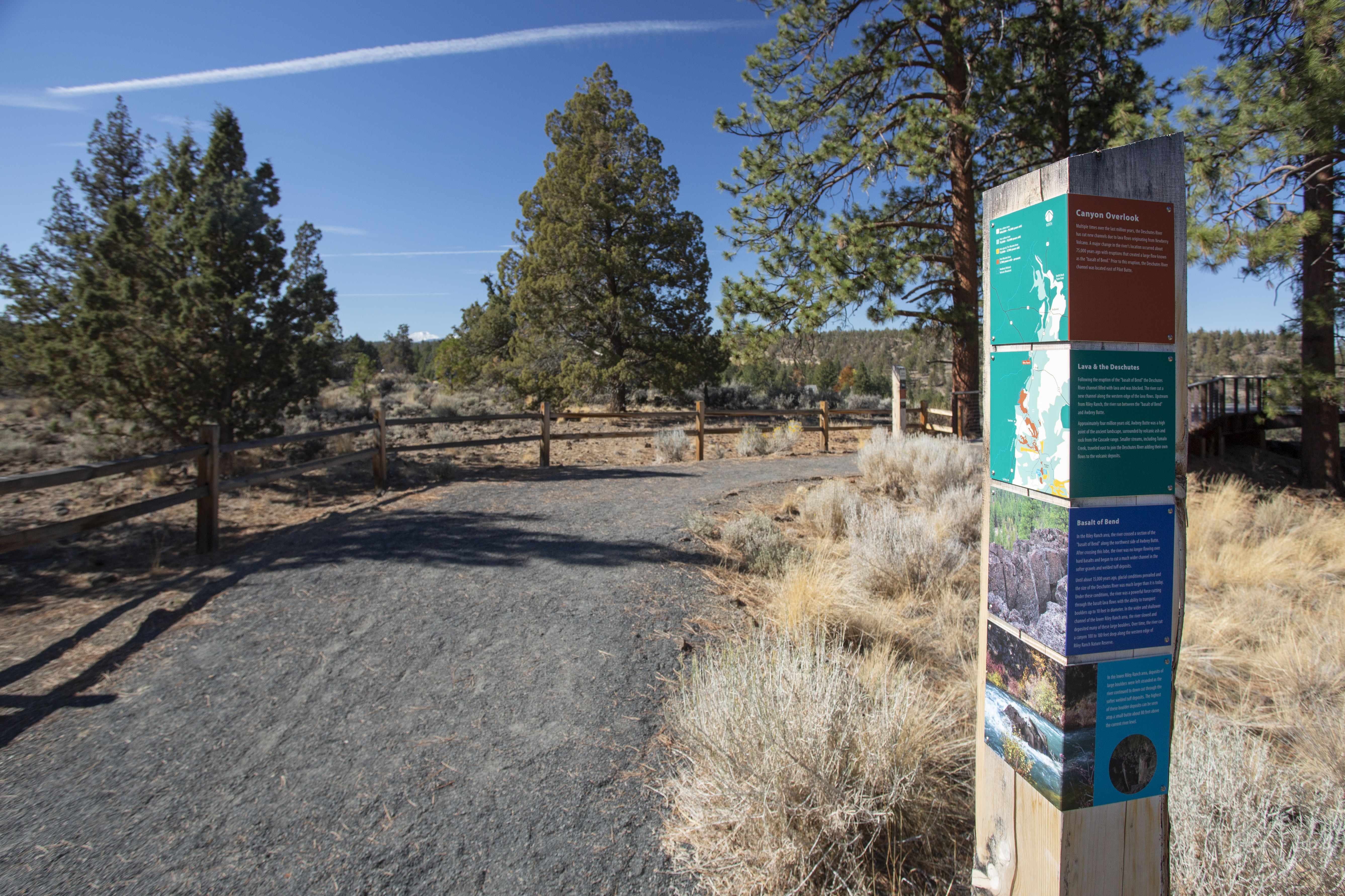 View of the trail and an information sign in Riley Ranch