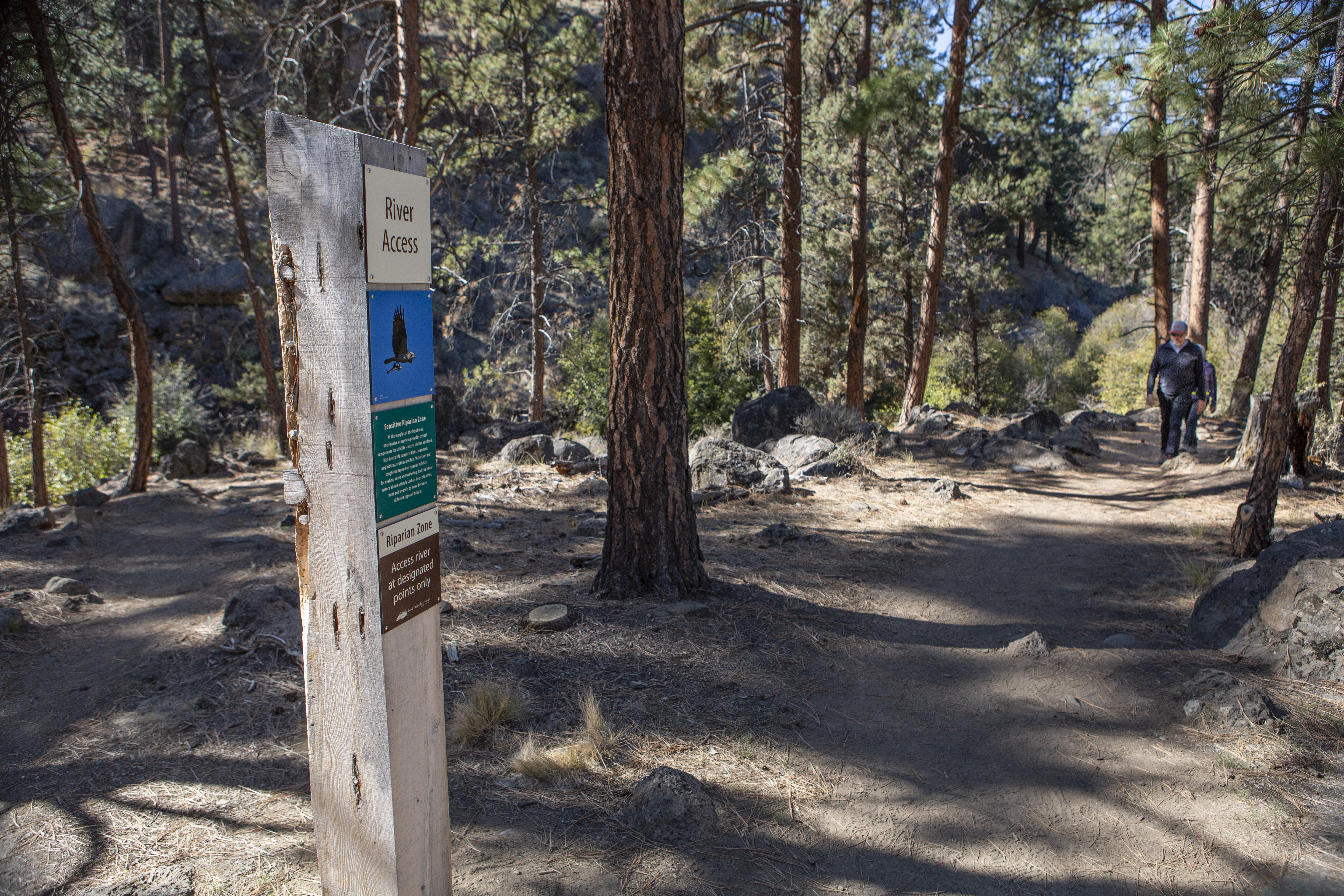View of the trail and an information sign in Riley Ranch