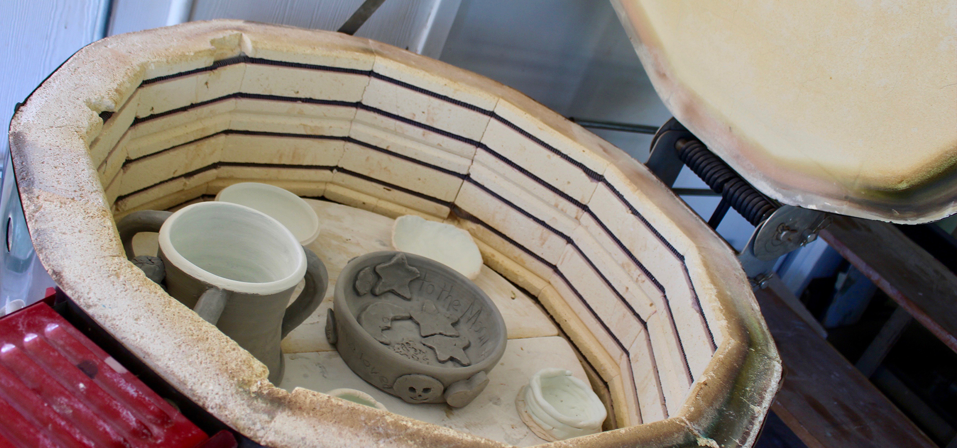 pottery ready to be baked at the art station.