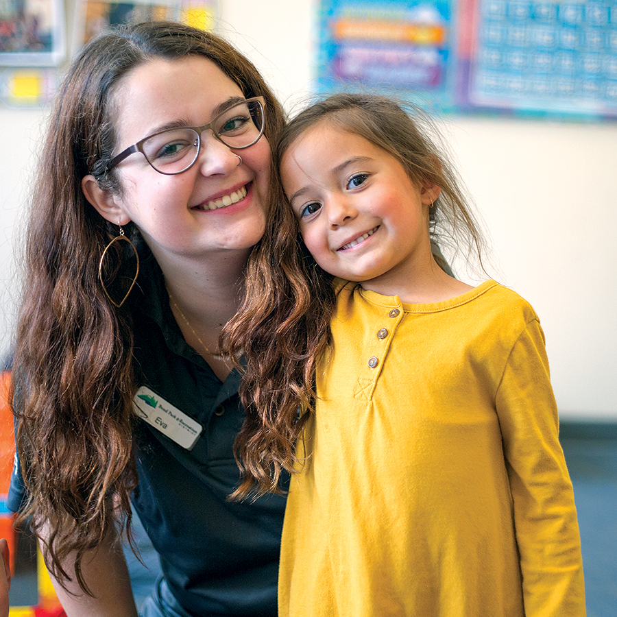 a kid and instructor in a childcare class in Bend.