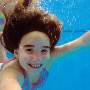 Image of a young lady swimming at a free family event at Bend Park and Recreation.