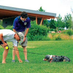 a Park Steward performing on-leash dog outreach in Bend parks.