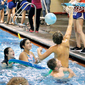 Kids playing basketball at Juniper Swim and Fitness during Free Family Night.