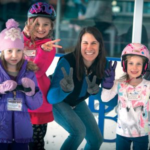 Children attending a youth learn to skate ice skating program in Bend, Oregon.