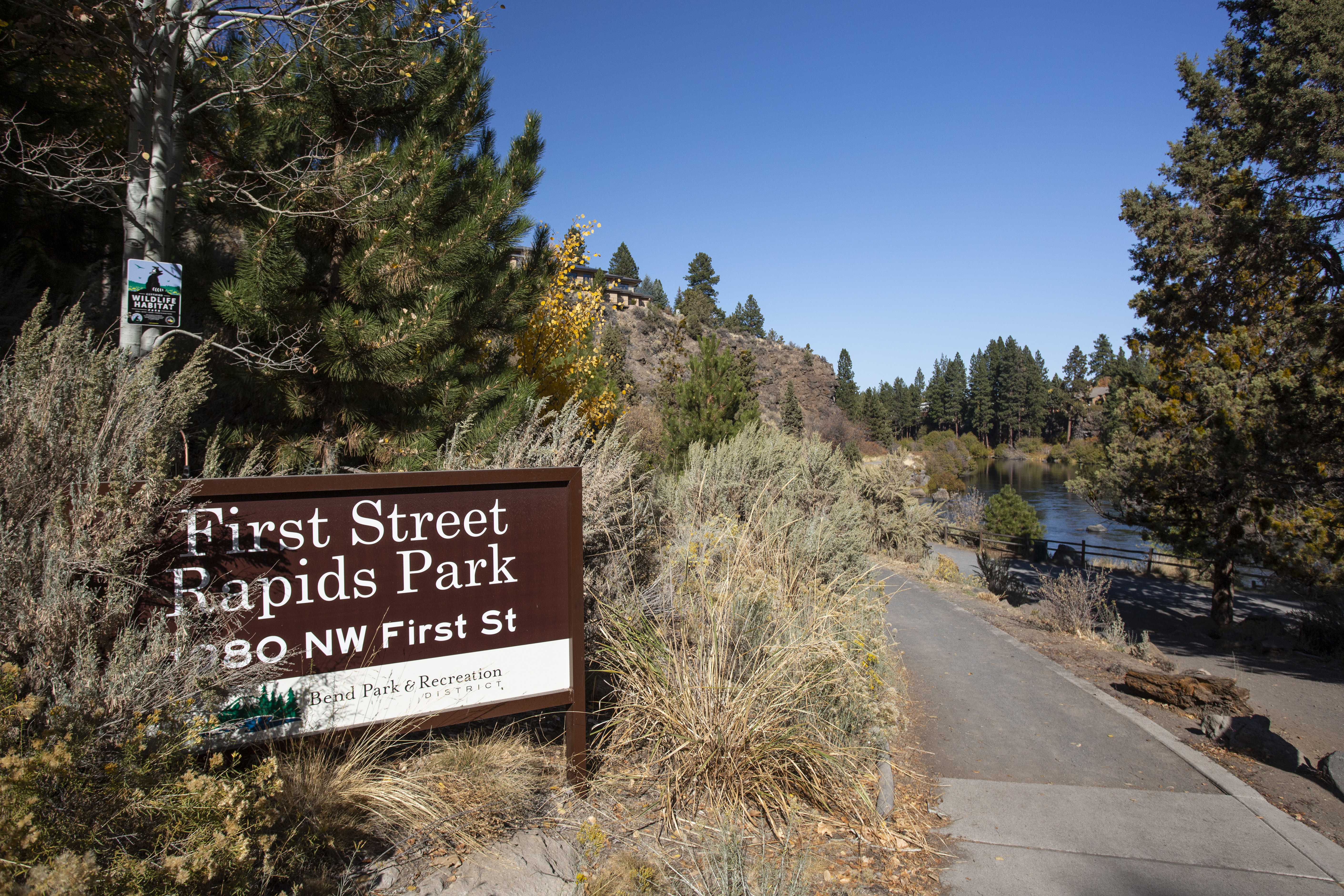 The entry sign at First Street Rapids Park on the west side