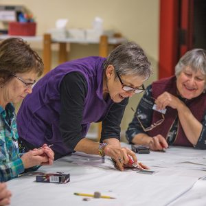 An adult art class at the Art Station.