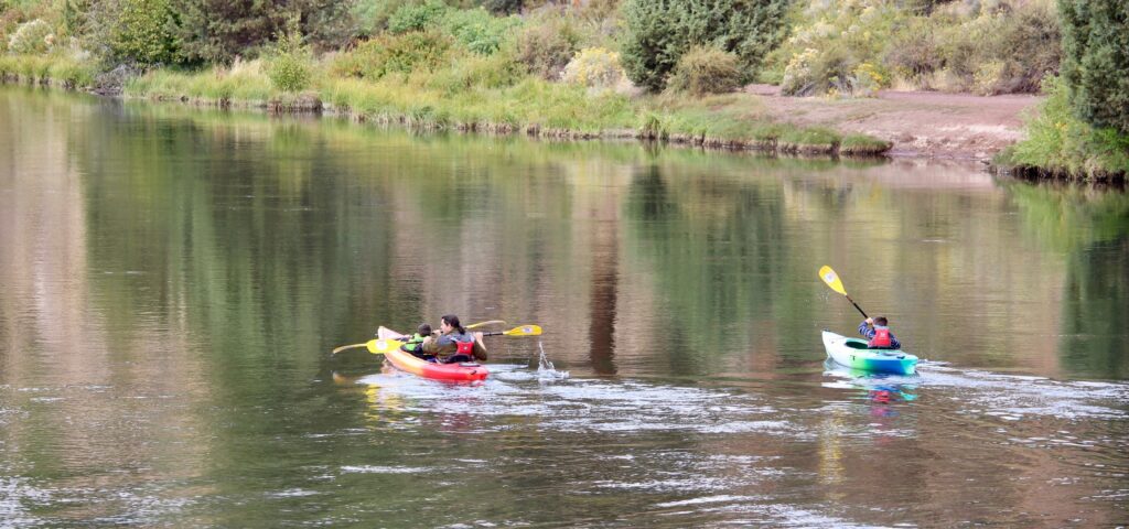 Two kayakers in the Deschutes River.