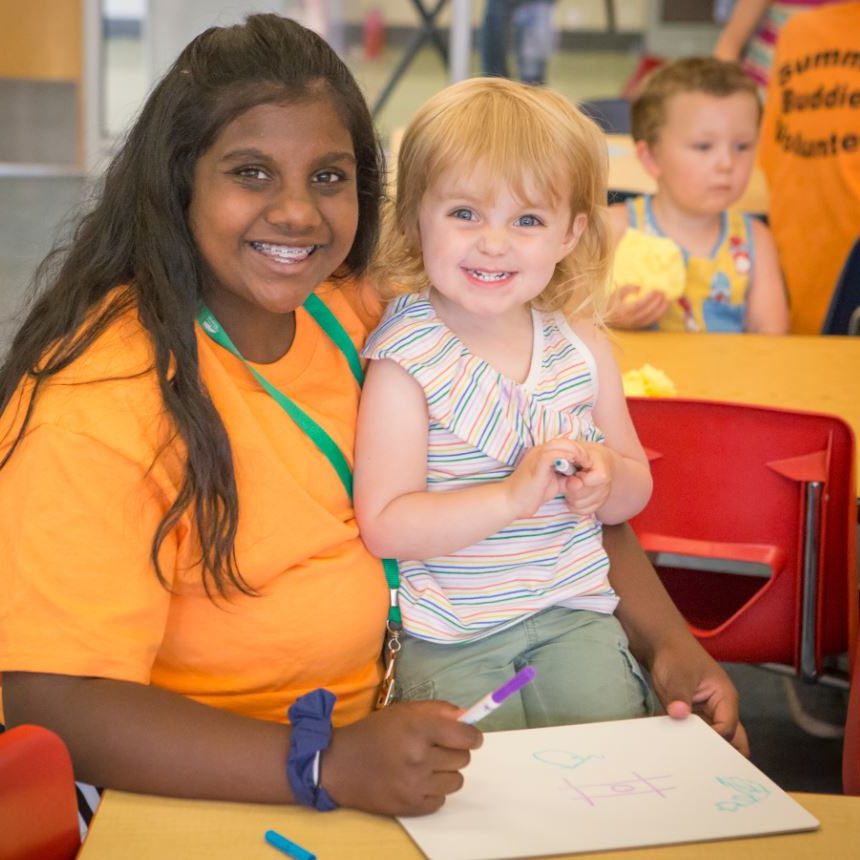 a teen volunteer at Summer Buddies childcare at Juniper.