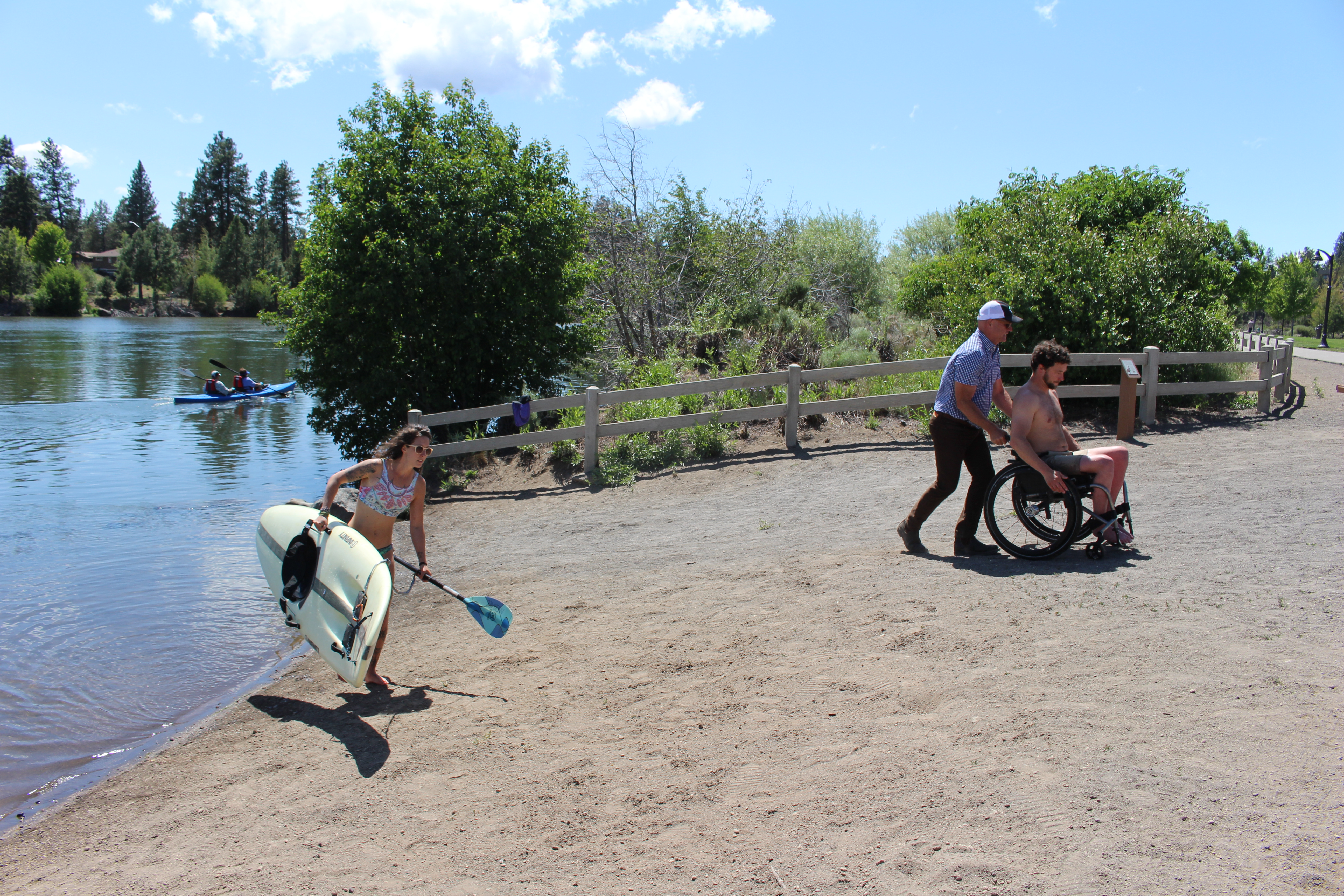 Image of park patrons at River Bend Park beach access.