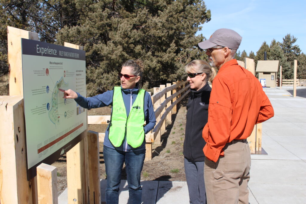 A volunteer speaks with patrons at Riley Ranch Nature Preserve