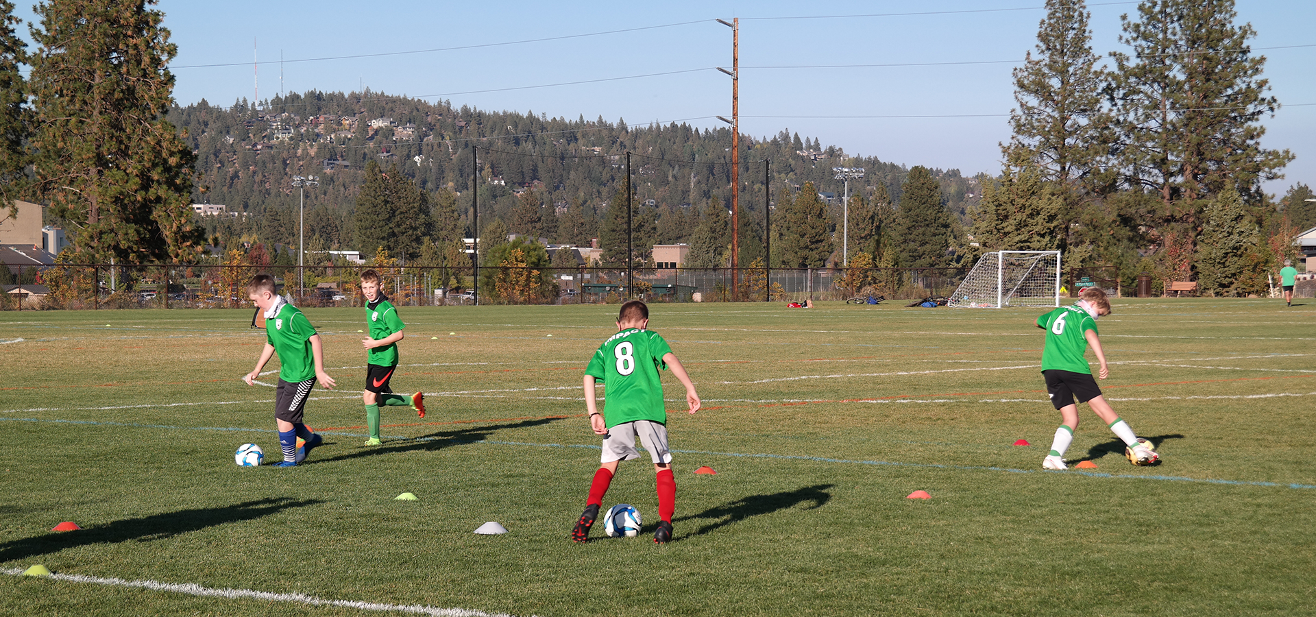 Boys practicing soccer at Pacific Crest's athletic fields.