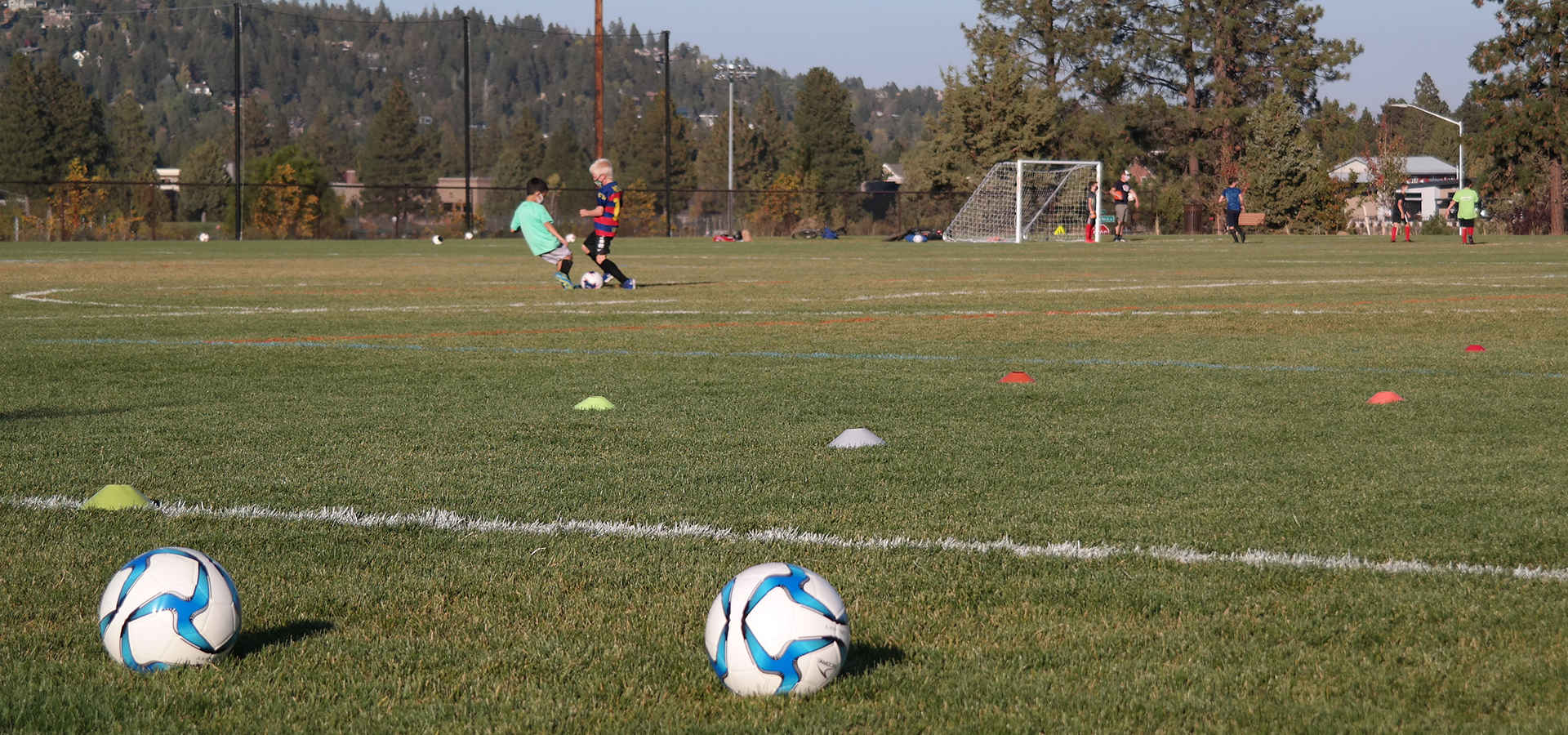 Boys practicing soccer at Pacific Crest's athletic fields.