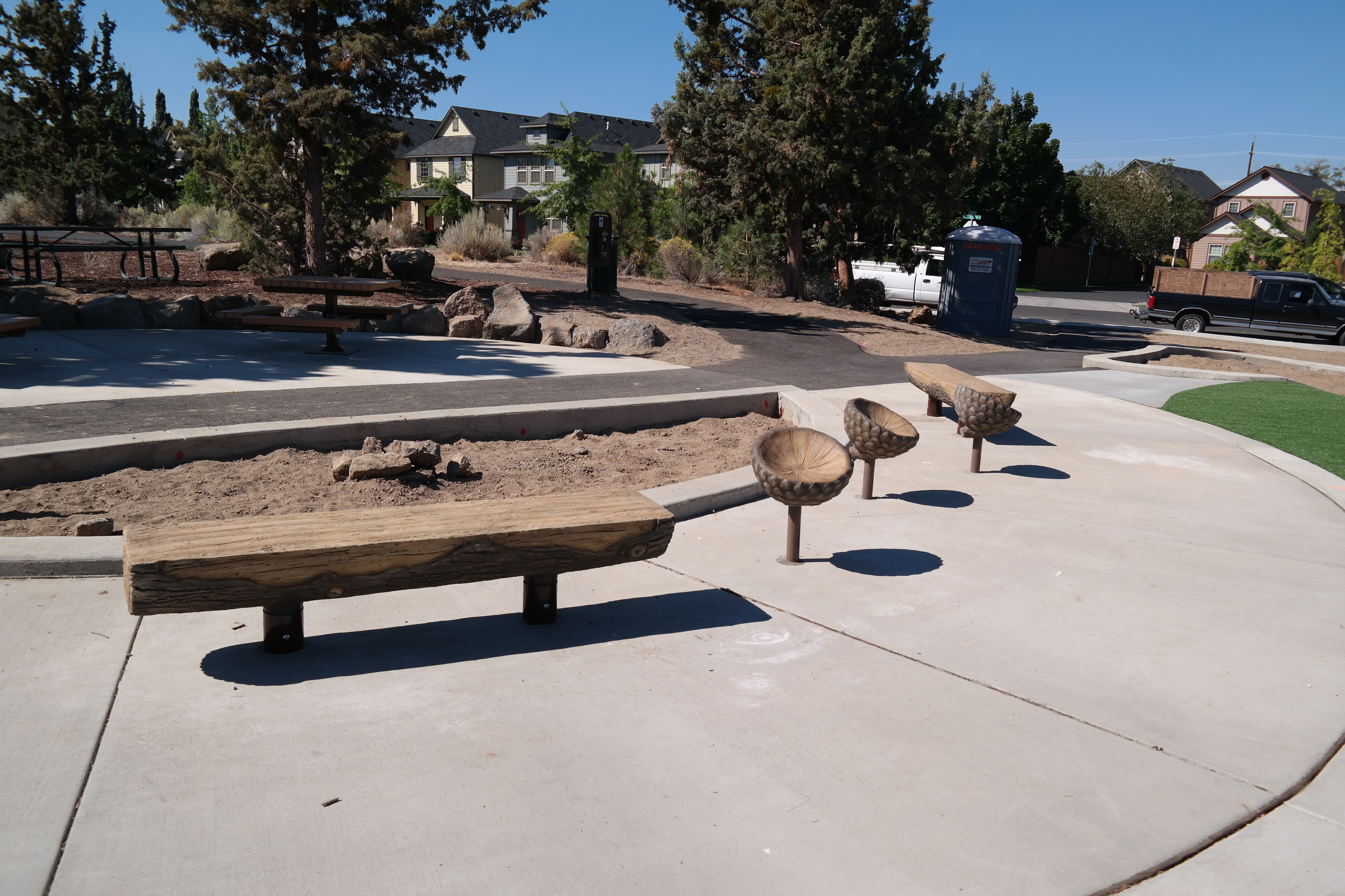 a bench and other seating at empire crossing park