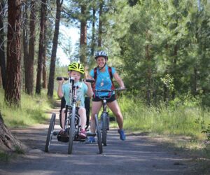 Child on adaptive bike in Shevlin Park