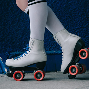 partial view of woman in white high socks and retro roller skates